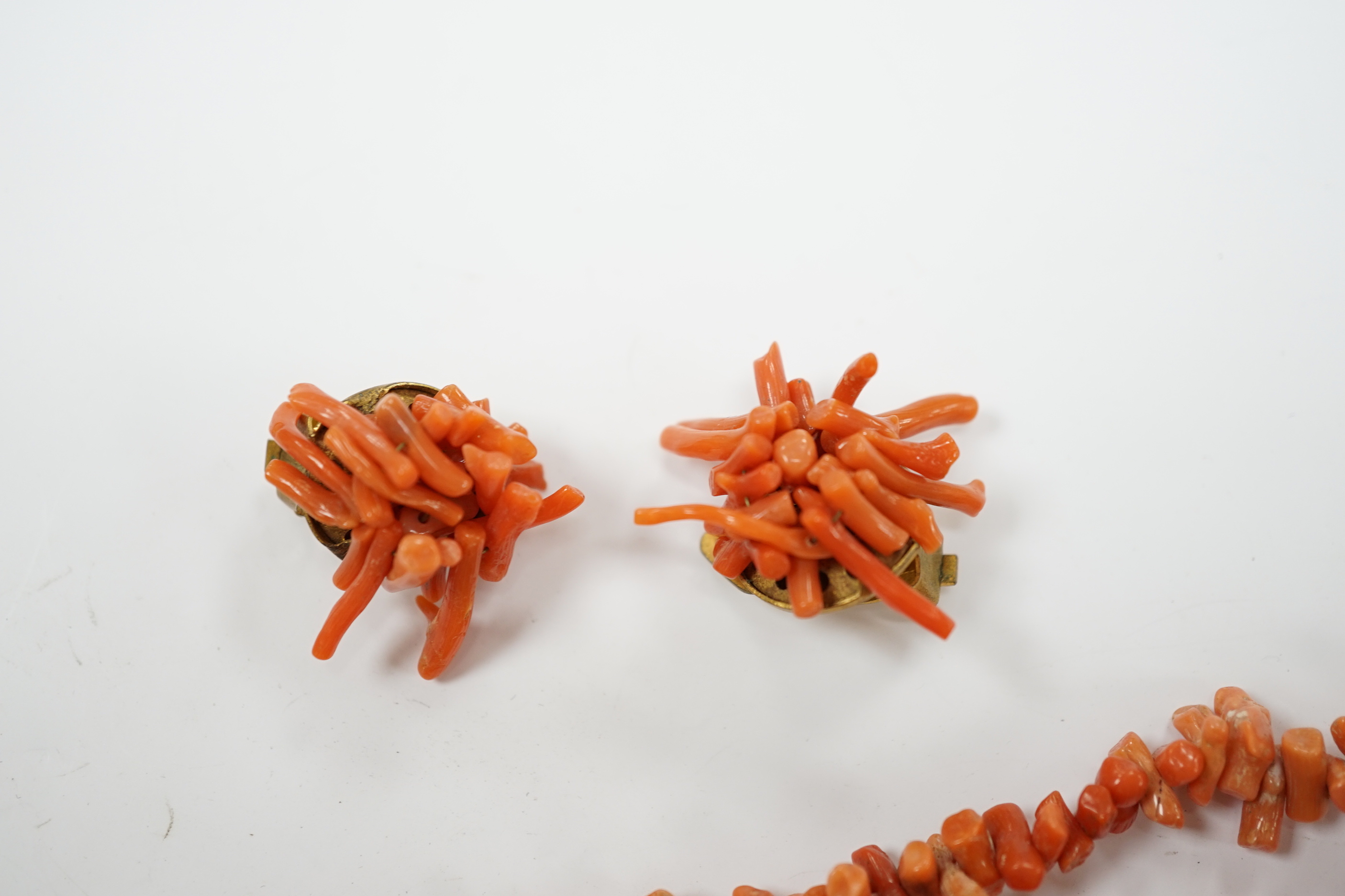 Two jagged coral necklaces, 46cm with a pair of similar earrings and a micro-mosaic and porcelain panel brooch (a.f.).